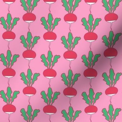 symmetrical red radishes on pink