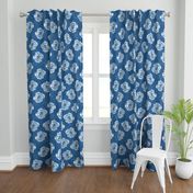 Mid size ikat roses on irregular classic blue spot ground