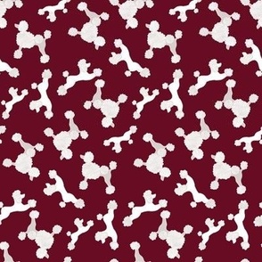 Poodles on burgundy red