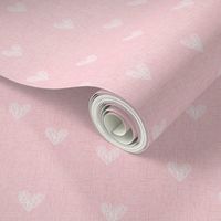 white hand drawn hearts on pink linen