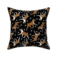 Trotting red Basenjis and paw prints - black