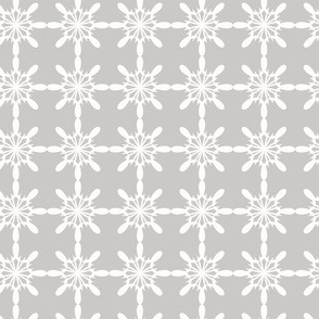 Abstract white snowflakes on grey