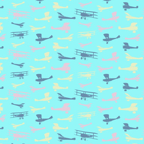 Airplane Silhouettes in Blue Yellow & Pink on Sky Baby Blue