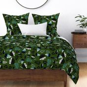 tropical leaves on dark green