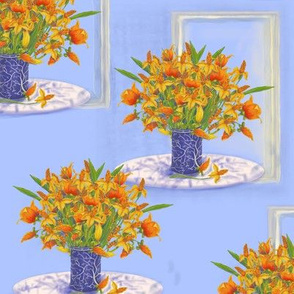 orange flowers in blue vase