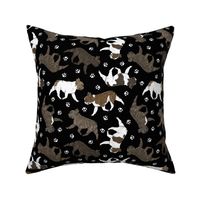 Trotting brindle French Bulldogs and paw prints - black