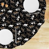 Trotting brindle French Bulldogs and paw prints - black