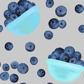 Bowls of blueberries on grey