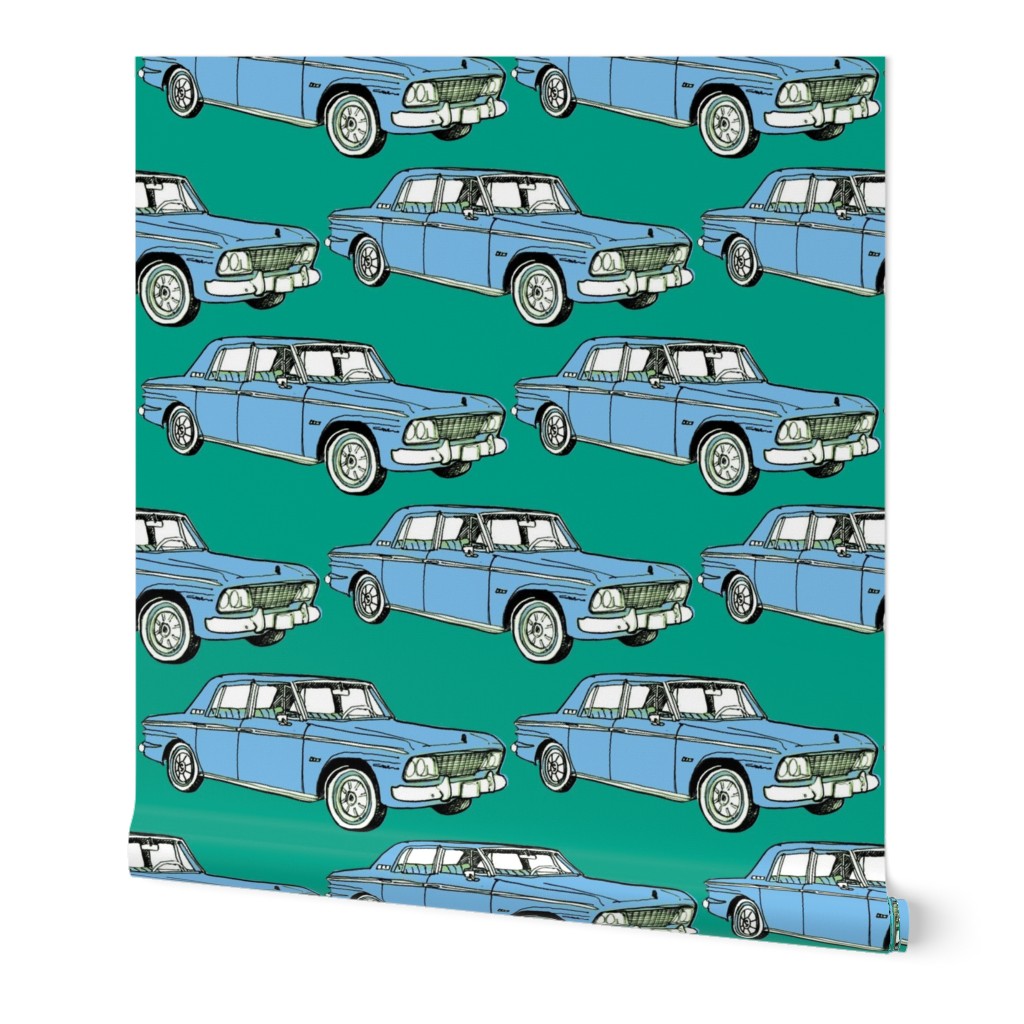 pale blue 1964 1965 Studebaker Lark Cruiser on teal background