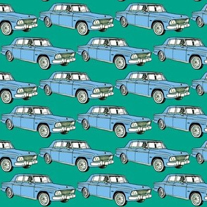 pale blue 1964 1965 Studebaker Lark Cruiser on teal background