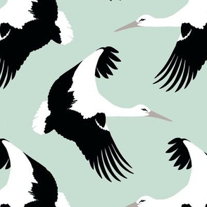 Storks in flight on robins egg blue 7”