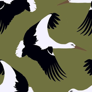 Storks in flight on olive green 10.5”