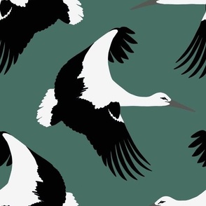Storks in flight on teal 10.5”