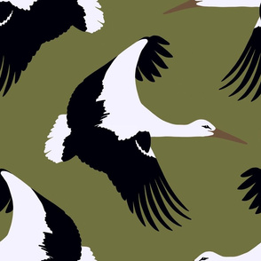 Storks in flight on olive green 18”