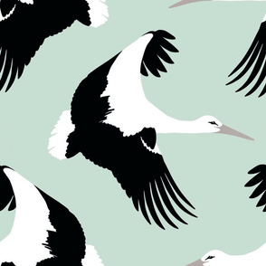 Storks in flight in robins egg blue 18”