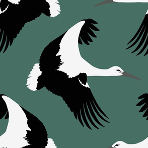 Storks in flight on teal 18”