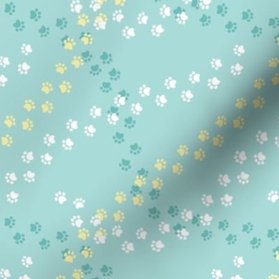 Small scale // Hot dogs chase // aqua background white yellow and aqua paw prints