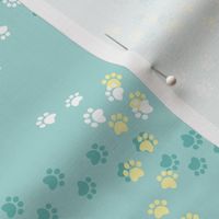 Small scale // Hot dogs chase // aqua background white yellow and aqua paw prints