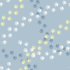 Small scale // Hot dogs chase // pastel blue background white yellow and blue paw prints