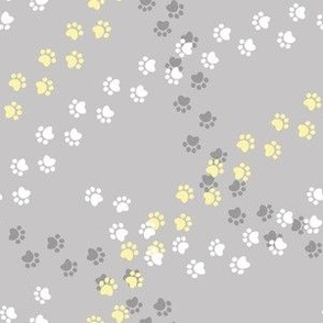 Small scale // Hot dogs chase // grey taupe background white yellow and grey paw prints
