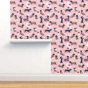 Tiny scale // Hot dogs and lemonade // pastel pink background Dachshund sausage dogs
