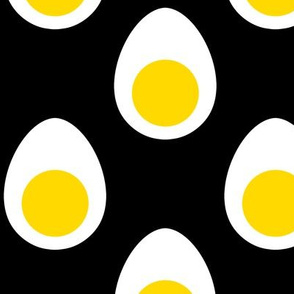 Large Yellow and White Hard Boiled Eggs on Black