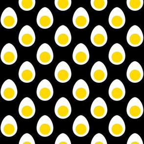 Small Yellow and White Hard Boiled Eggs on Black