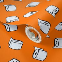 Toilet paper tissue rolls on bright orange