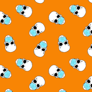 skulls in medical masks on orange