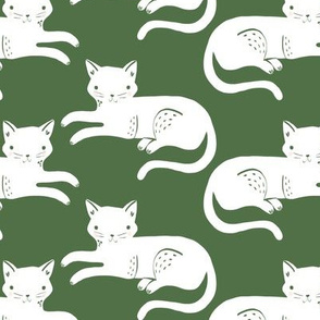 lounging cats // white cats on green