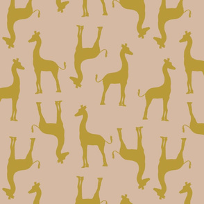 modern giraffe in mustard on sand 