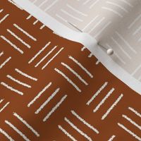 mudcloth basket weave, white on rust