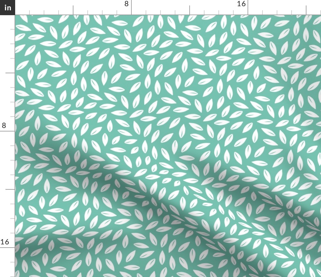 White tossed leaves on teal