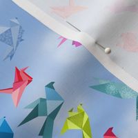 origami birds in flight clouds small