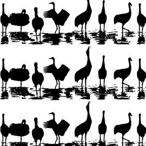 Horizontal crane silhouettes in black and white