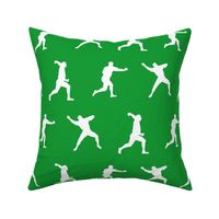 Baseball Player Silhouettes in White on Green Background