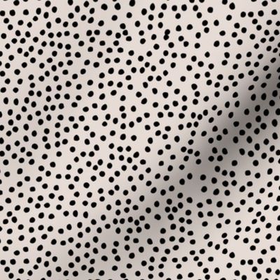 Irregular minimal spots and dots cheetah animal print nursery trend off white black
