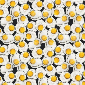 Fried egg feast on black