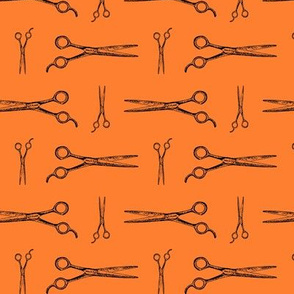 Hair Cutting Shears in Black with Halloween Orange Background