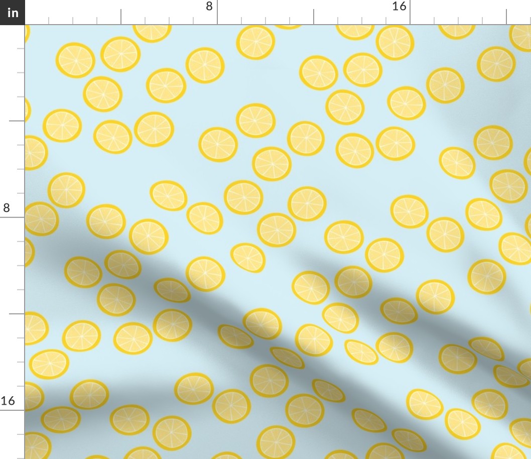 Little slices of lemon bright yellow fruit cocktail summer design on blue