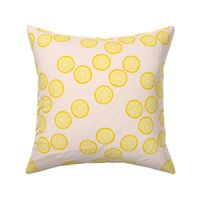 Little slices of lemon bright yellow fruit cocktail summer design on pale pink