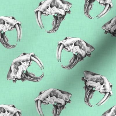 Scattered Sabre Tooth Tiger Skulls on Mint Linen