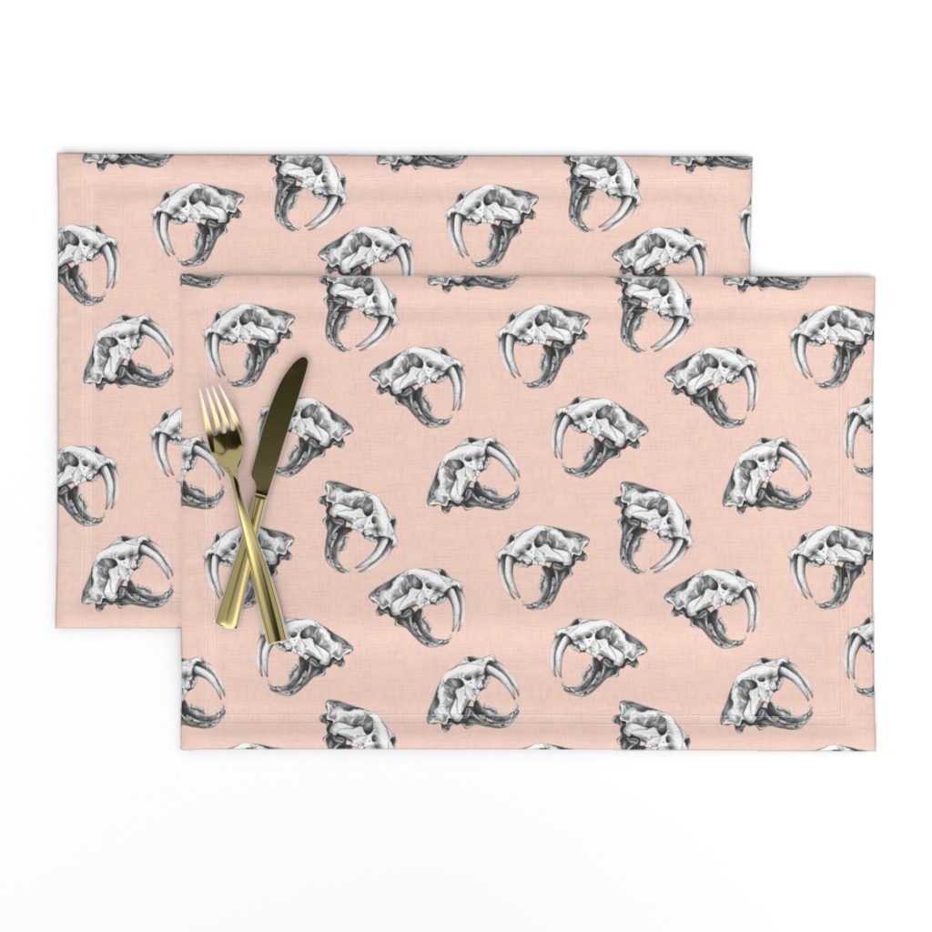 Scattered Sabre Tooth Tiger Skulls on Pink Linen