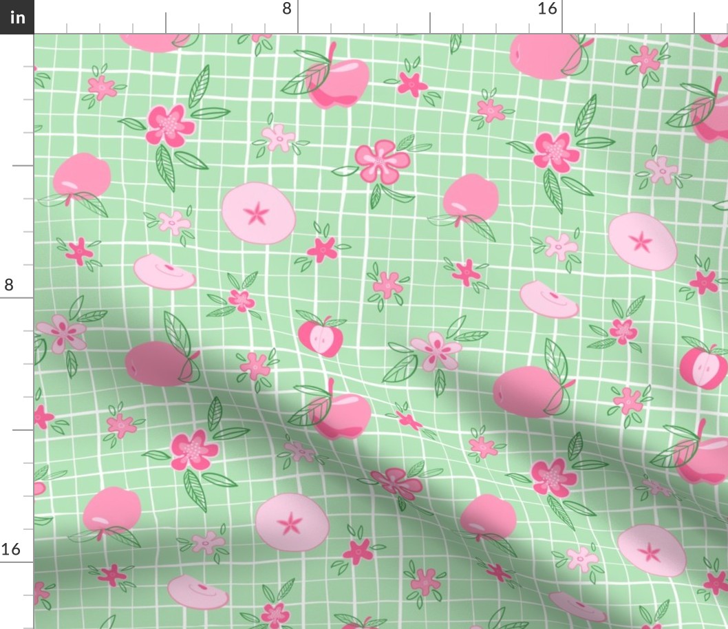 Pink apples and flowers on green and white plaid background
