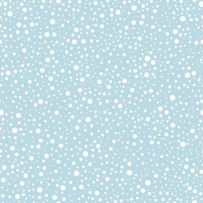 White polka dots on a baby blue background