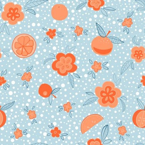 Oranges and flowers scattered on a baby blue background with white polka dots